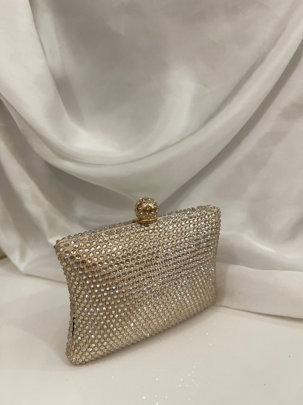 Golden Swarovski clutch