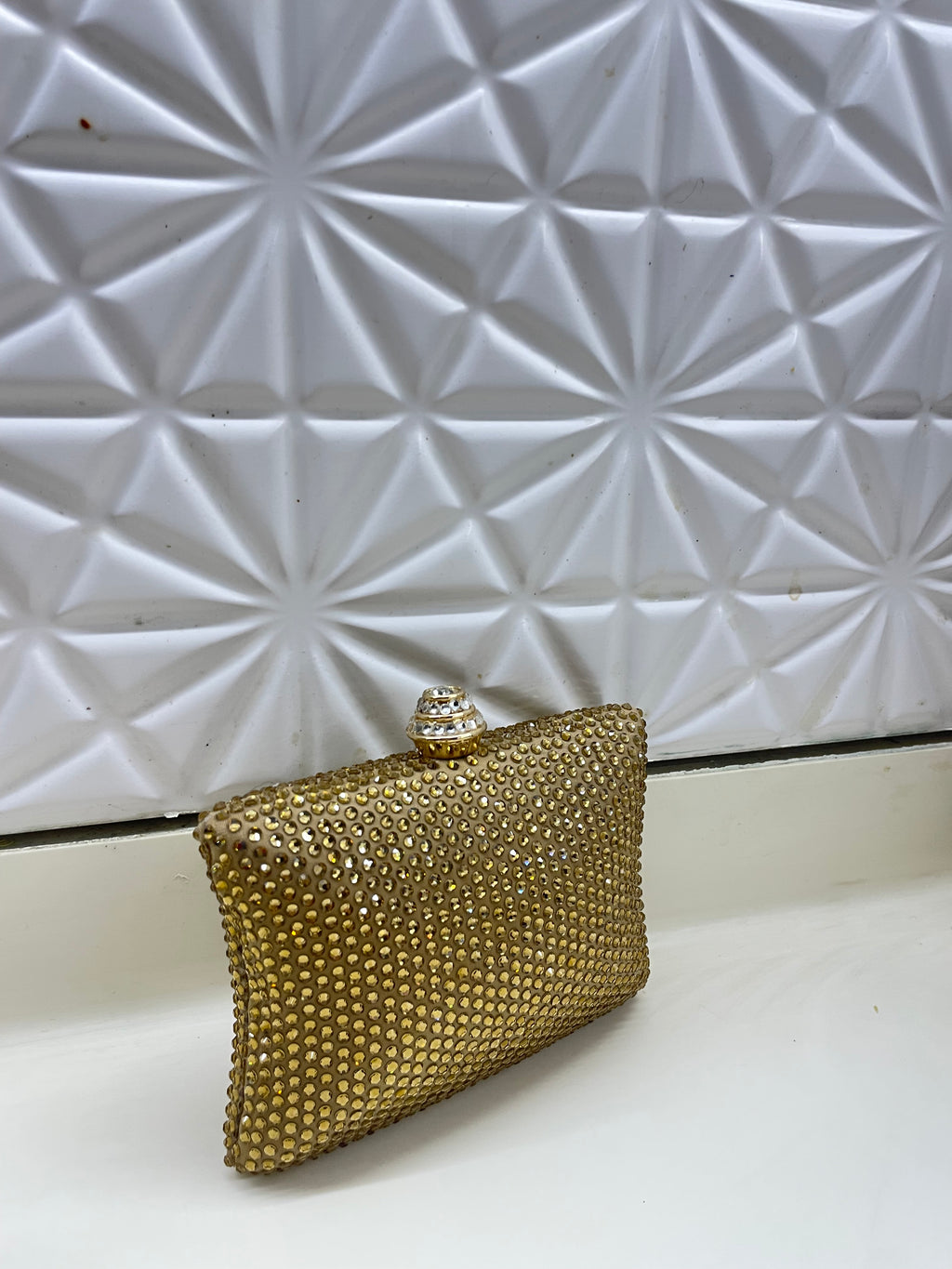 Golden Swarovski clutch