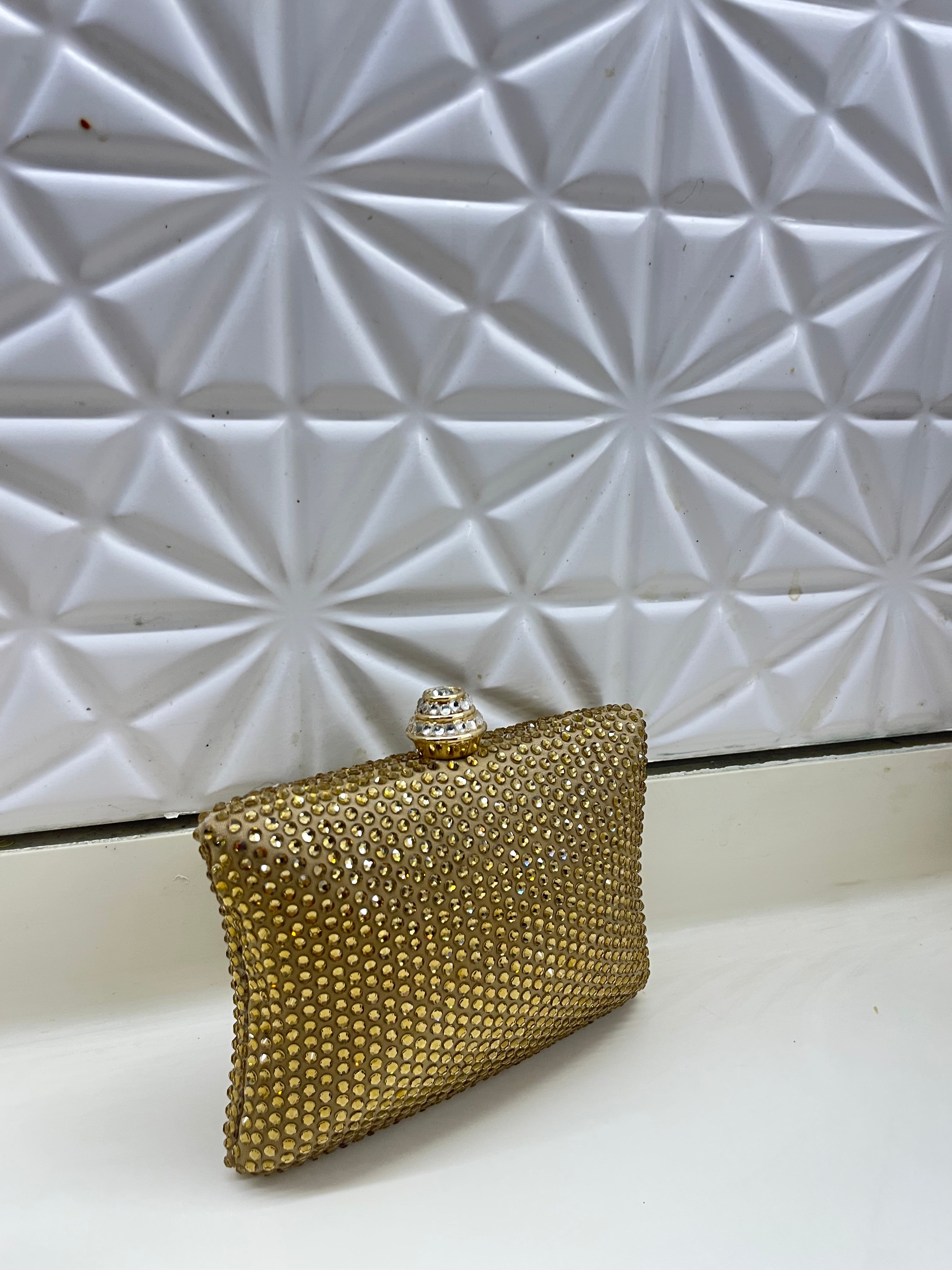 Golden Swarovski clutch