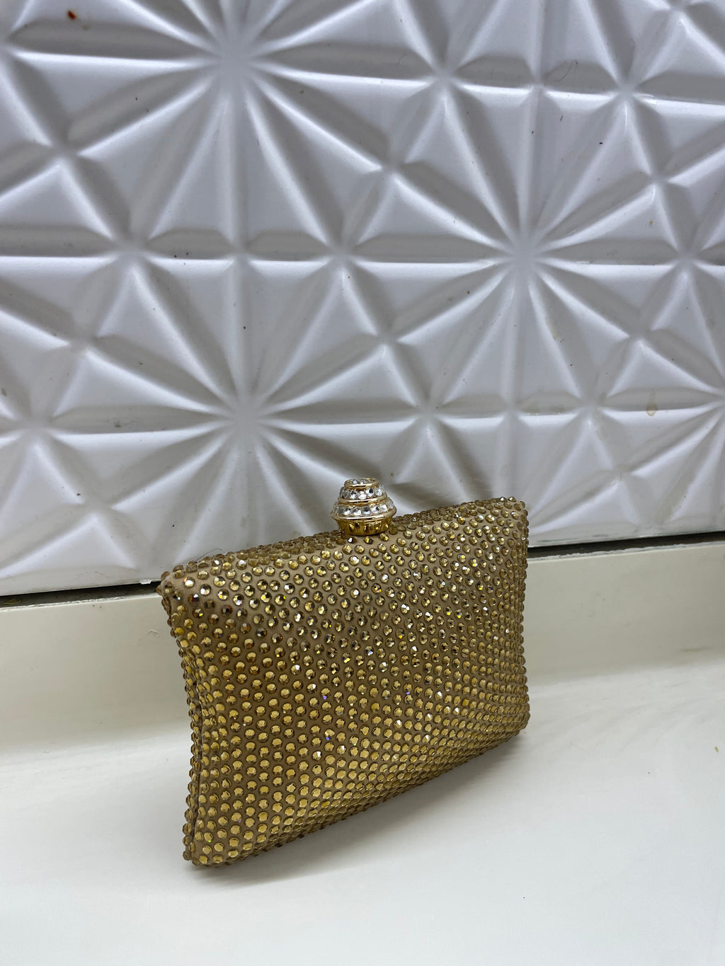 Golden Swarovski clutch