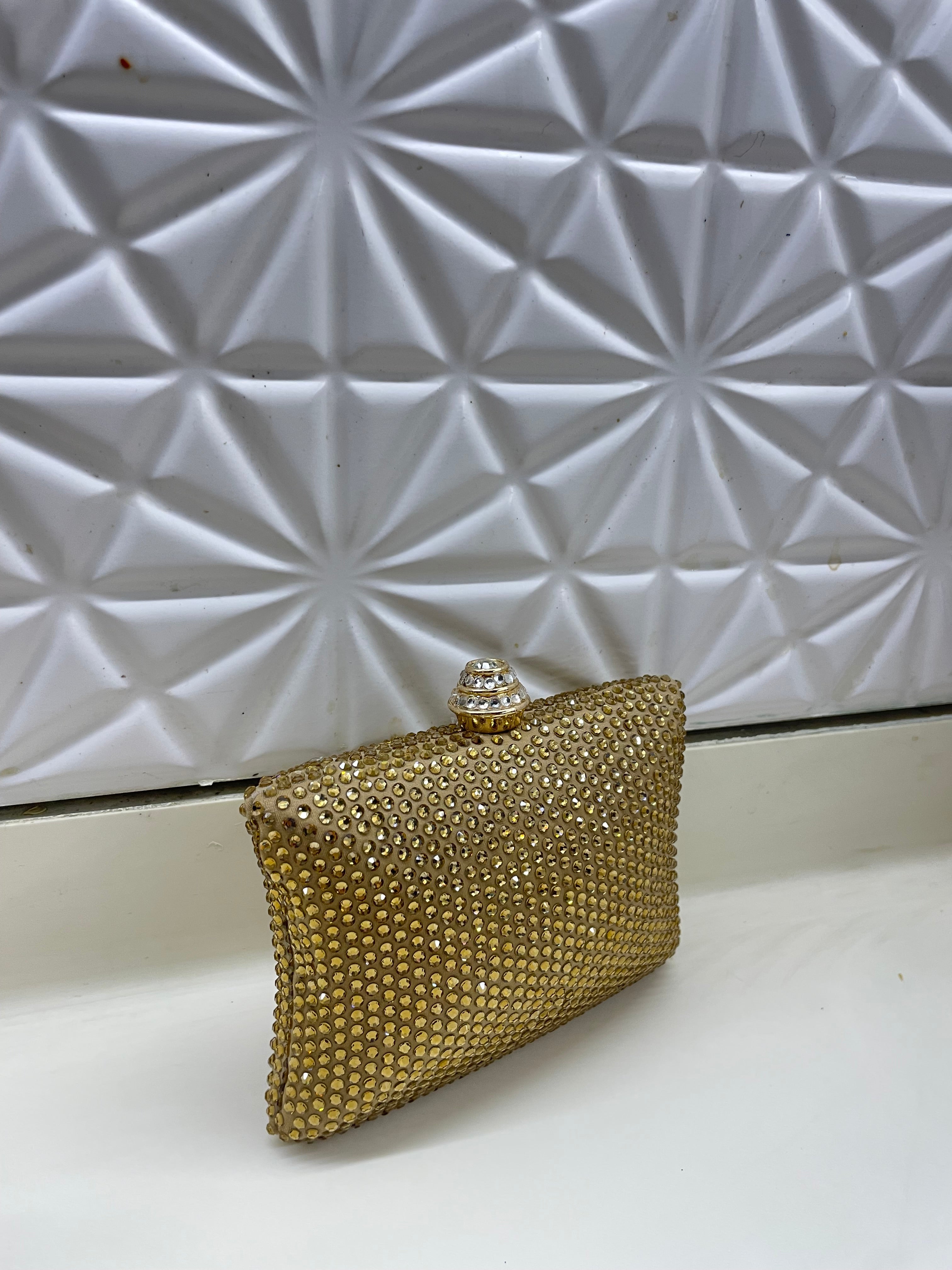 Golden Swarovski clutch