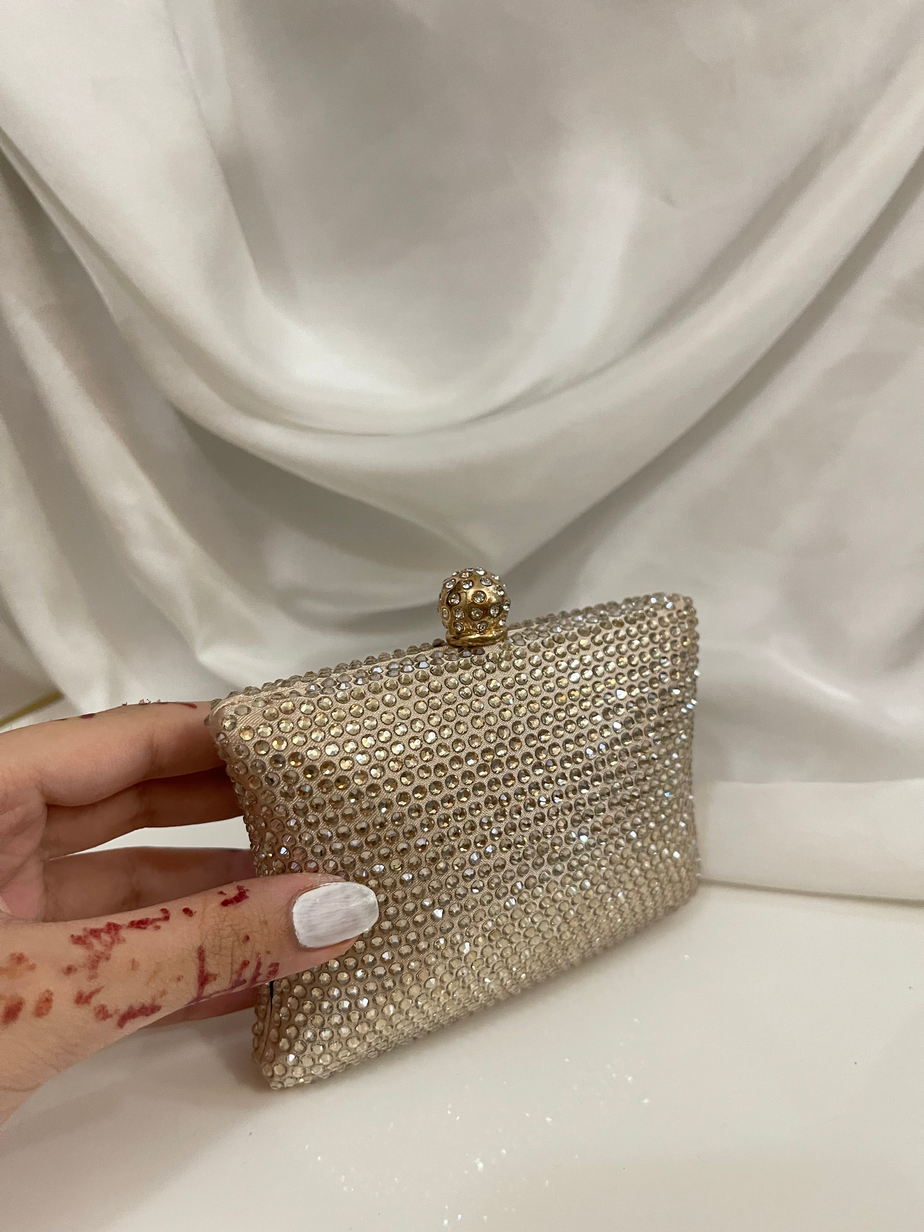 Golden Swarovski clutch