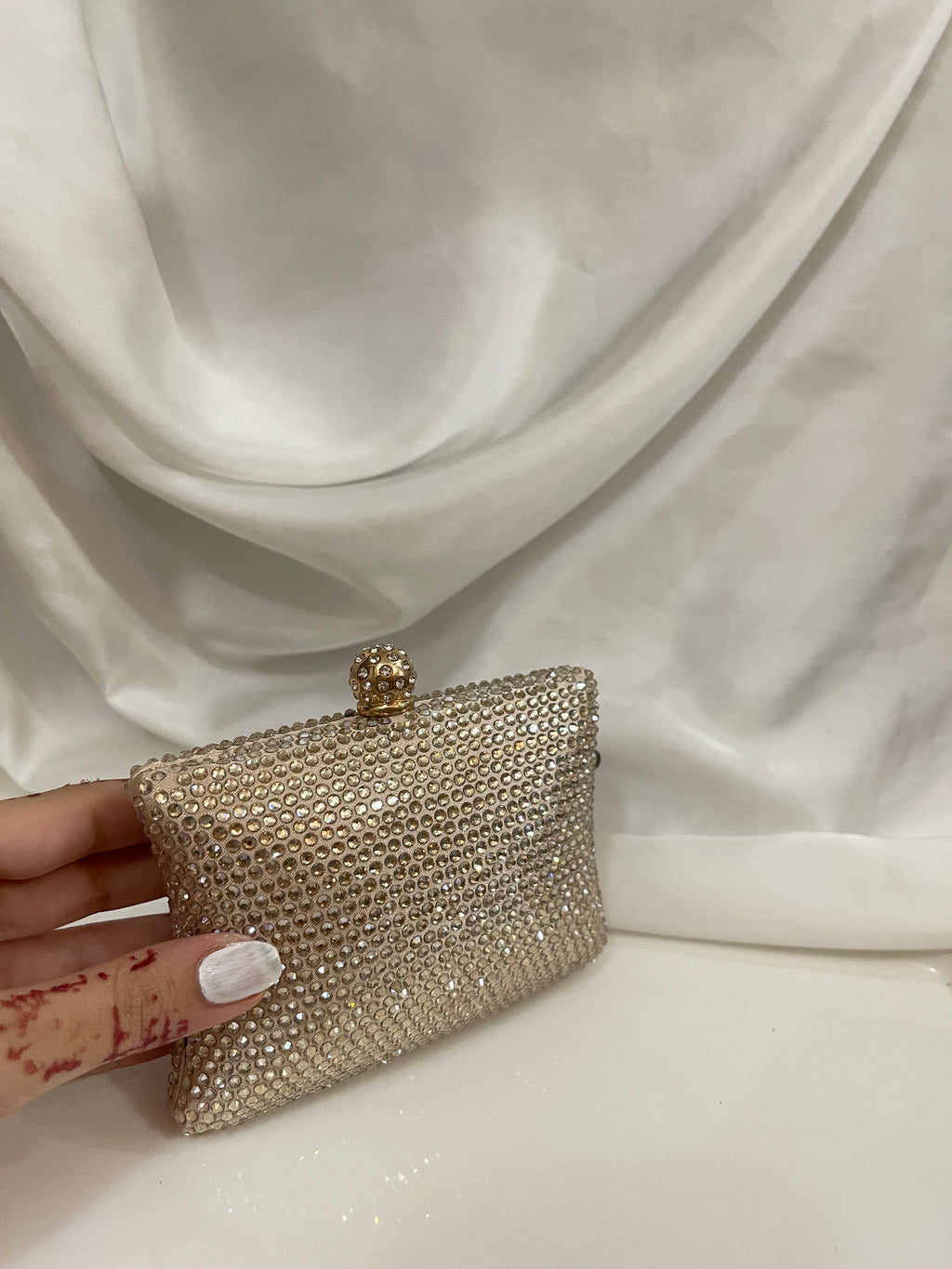 Golden Swarovski clutch