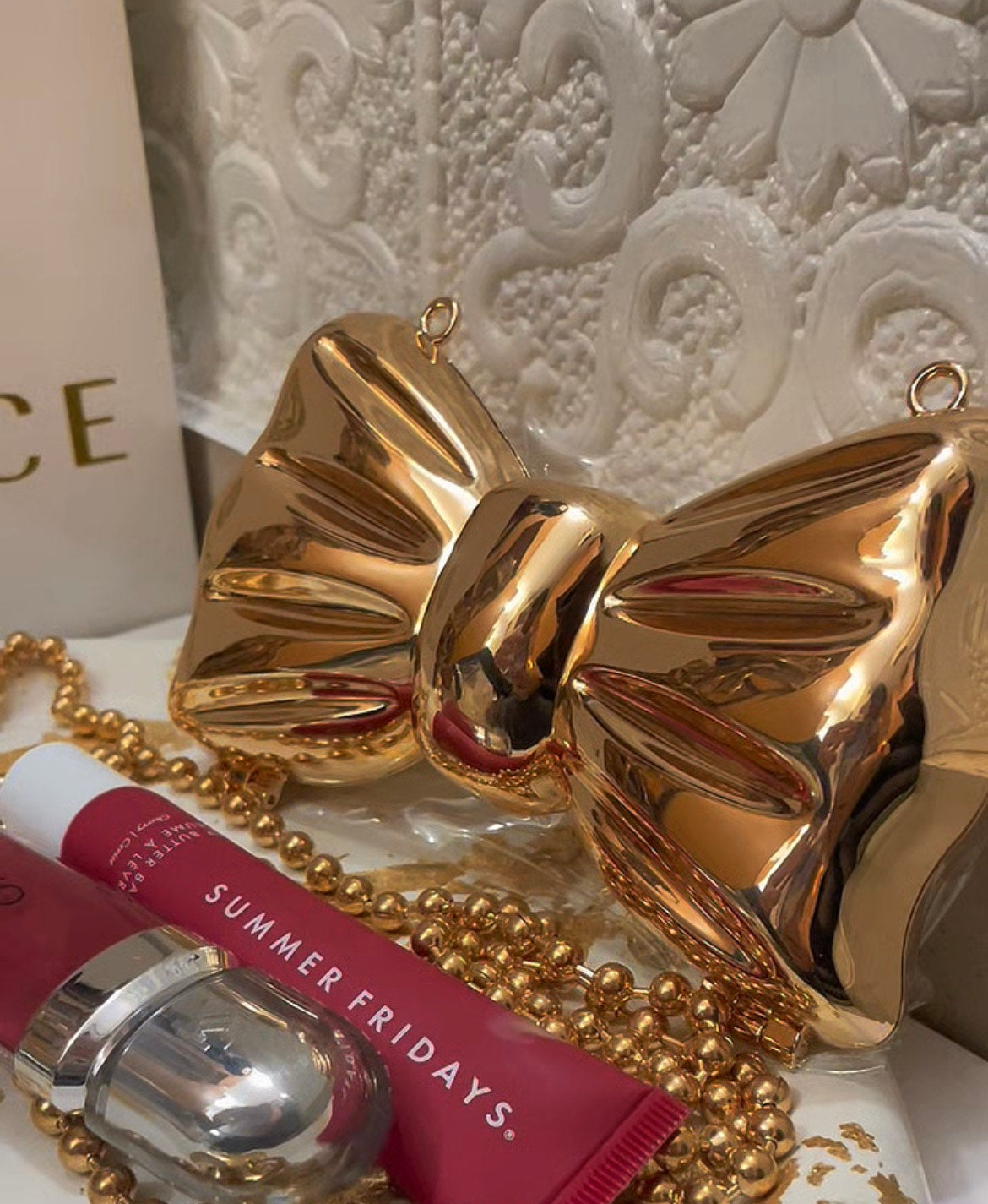 Metallic finish bow clutch