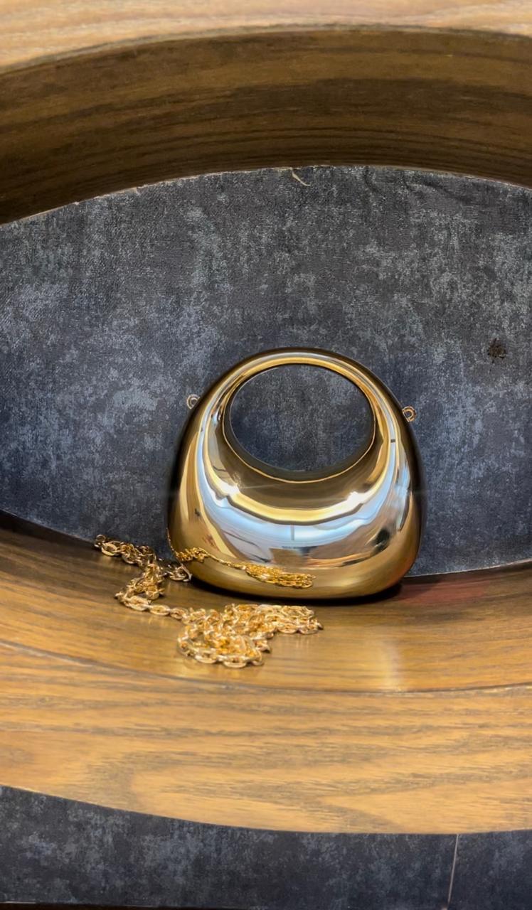 Crescent moon cross body clutch.