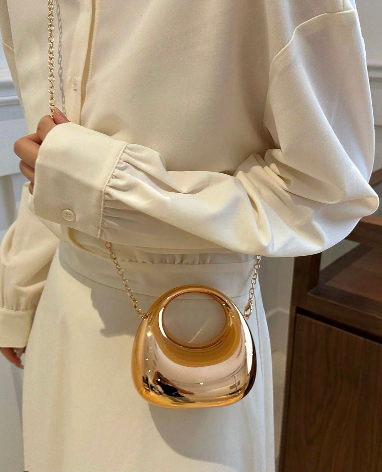 Crescent moon cross body clutch.